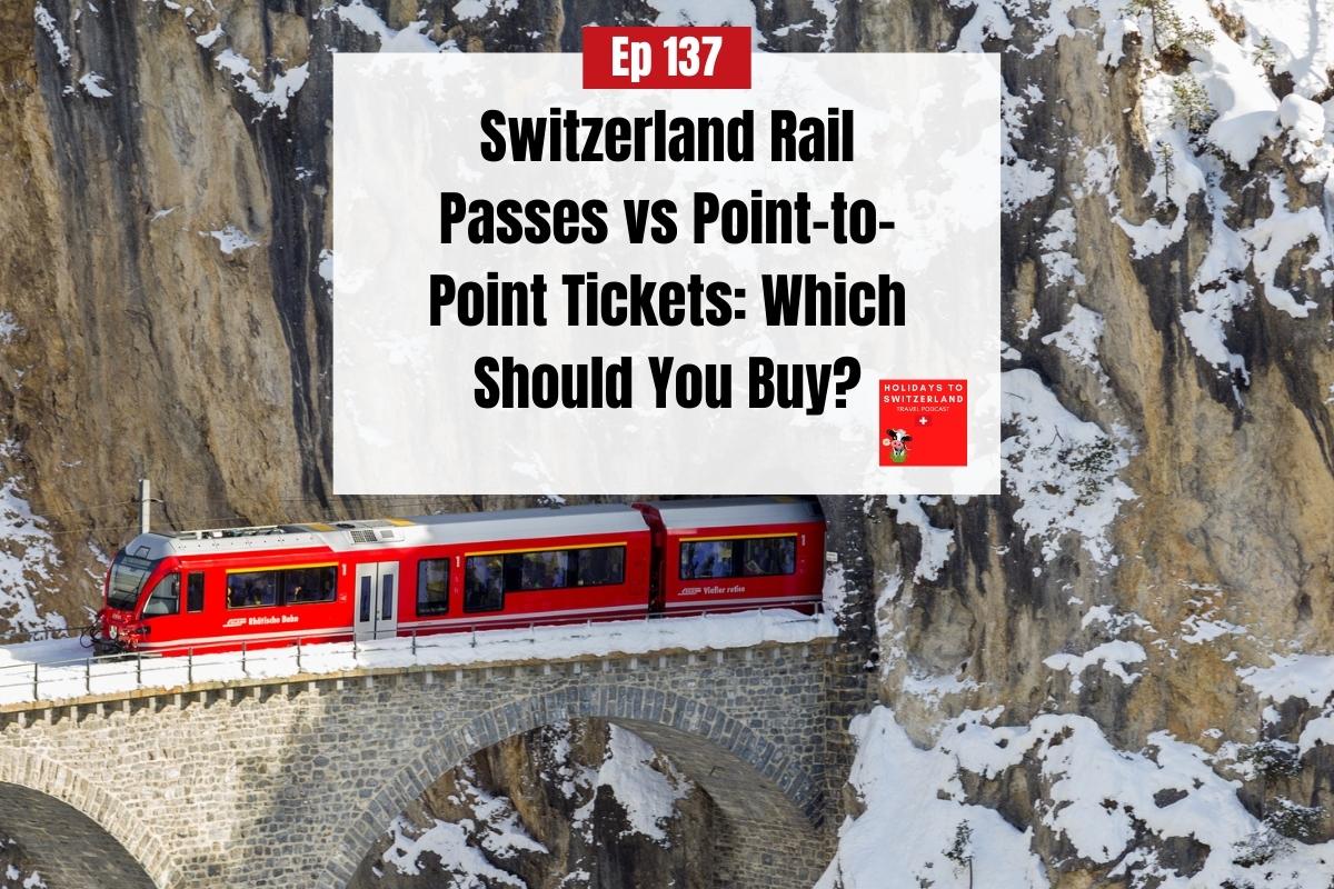 Red train coming out of a tunnel and onto a bridge in Switzerland