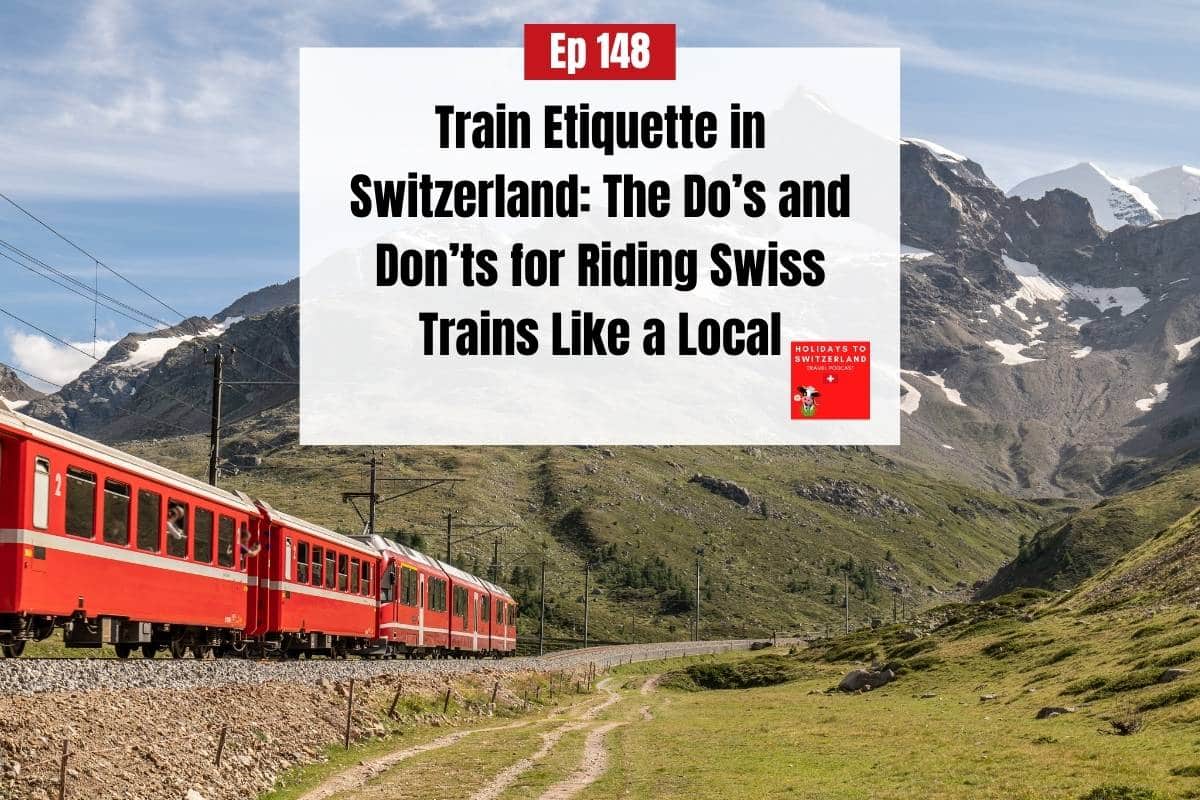 Red train travelling in mountainous countryside