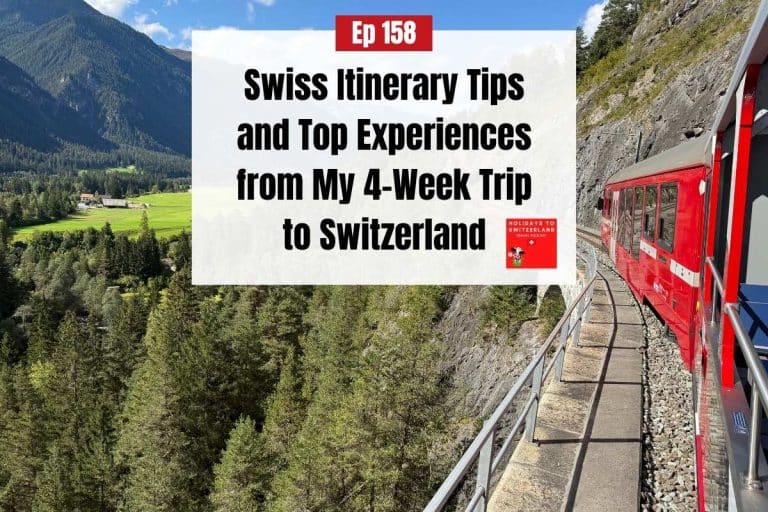 Red train with open air carriage crossing a bridge