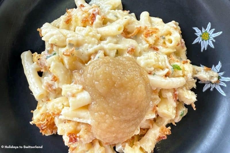 Alplermagronen, a cheese and noodle dish, served with apple sauce